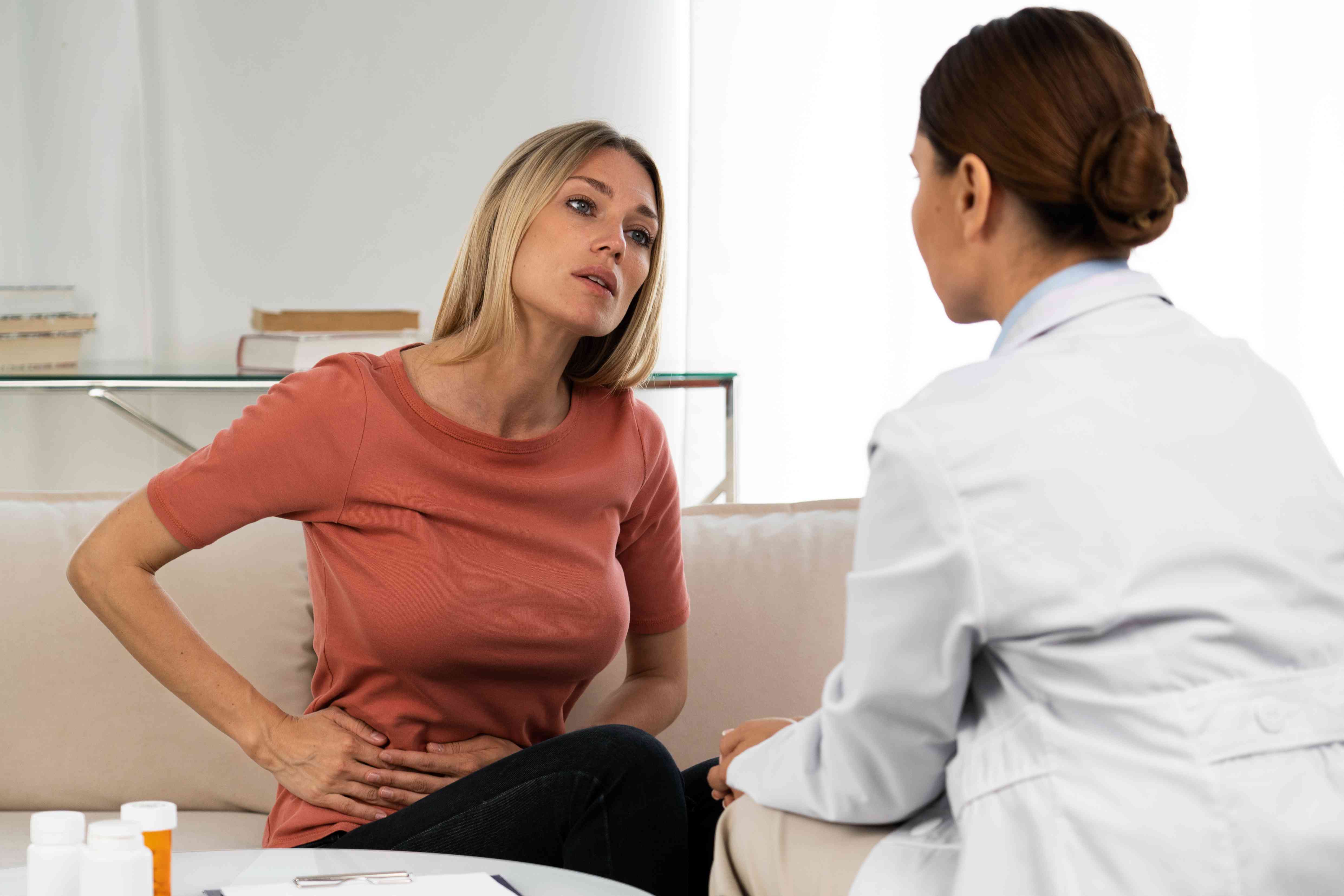 side-view-doctor-talking-woman-compressed