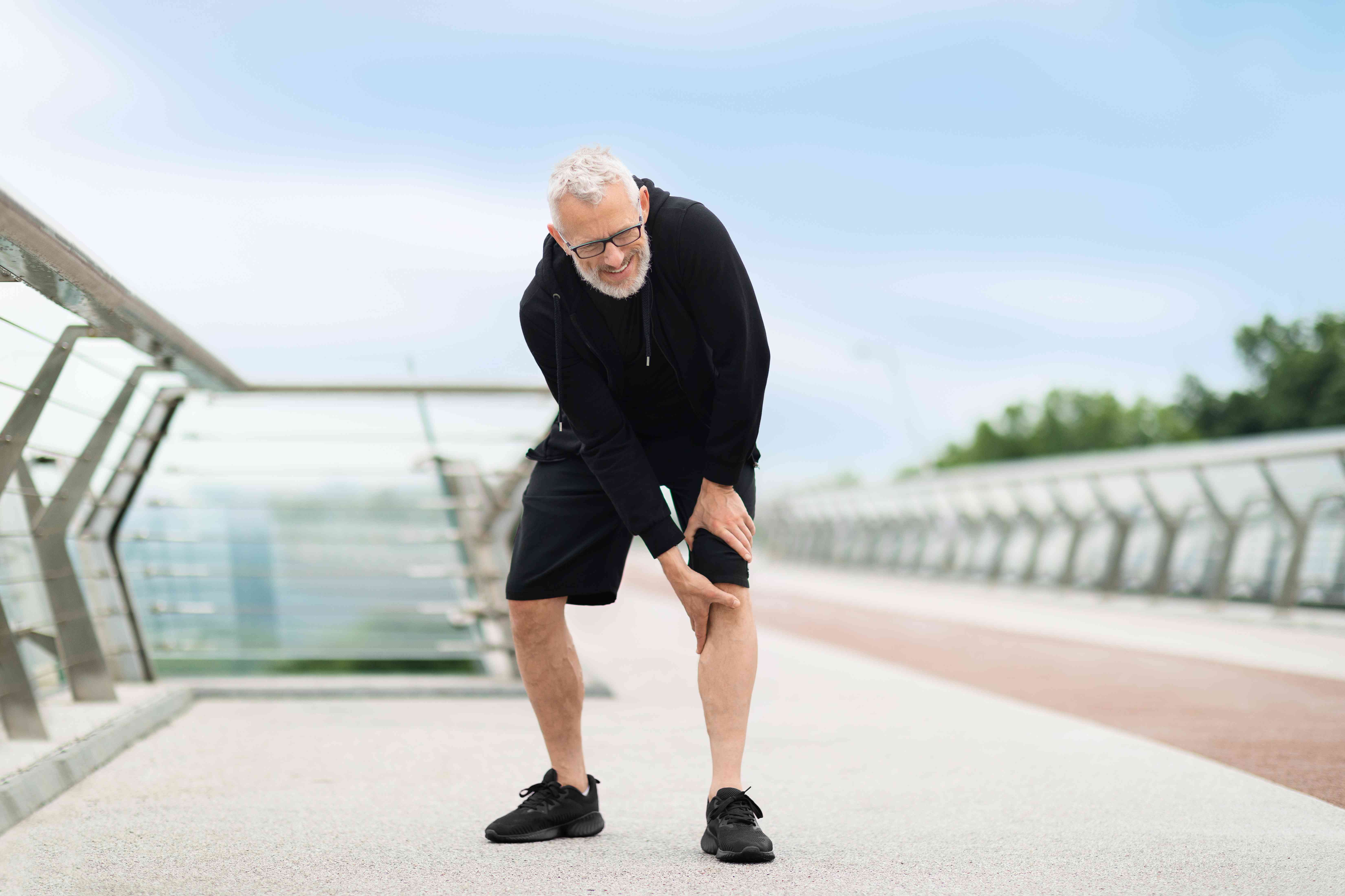 senior-man-suffering-with-knee-pain-workout-compressed