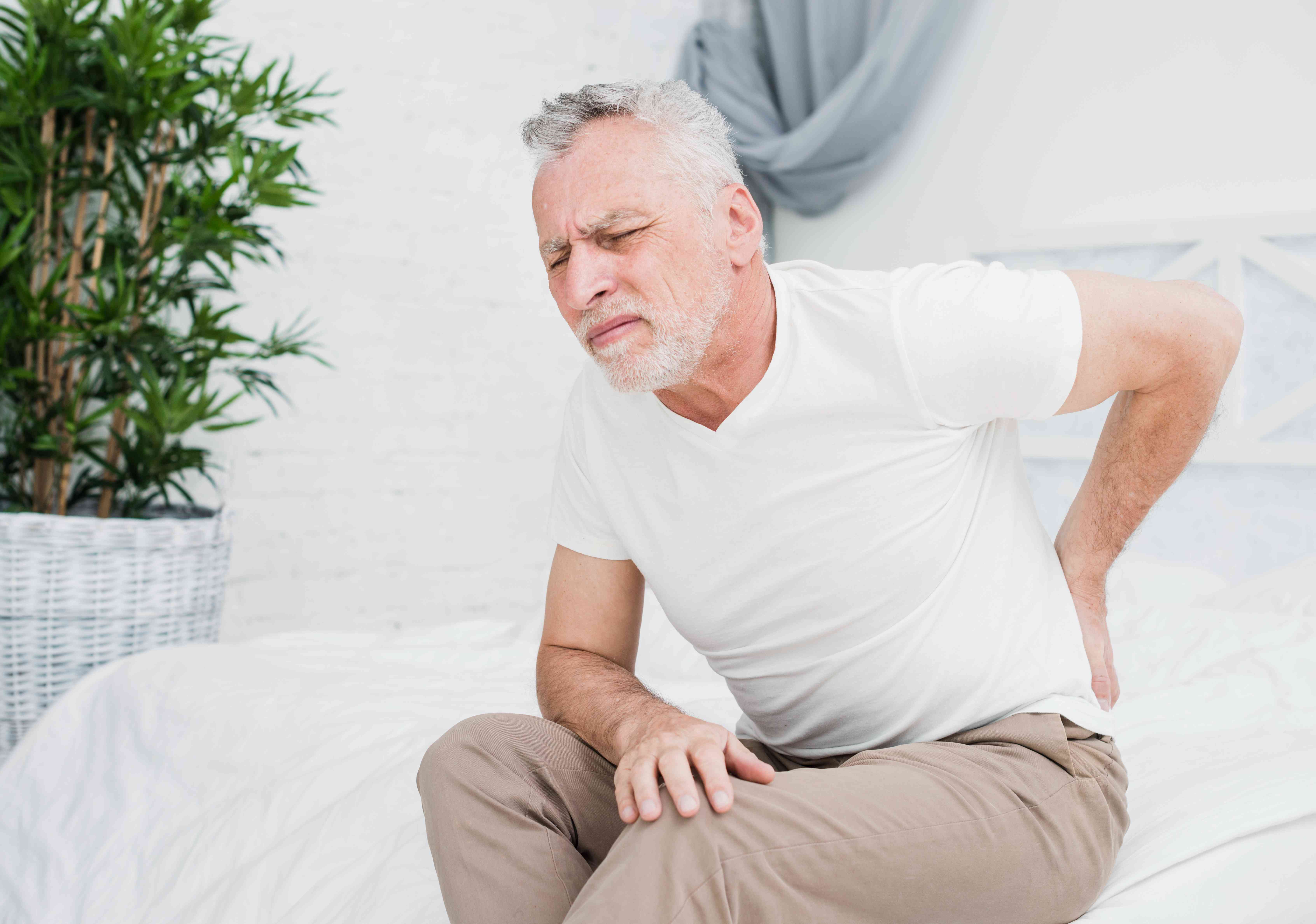 elder-man-with-back-pain-compressed